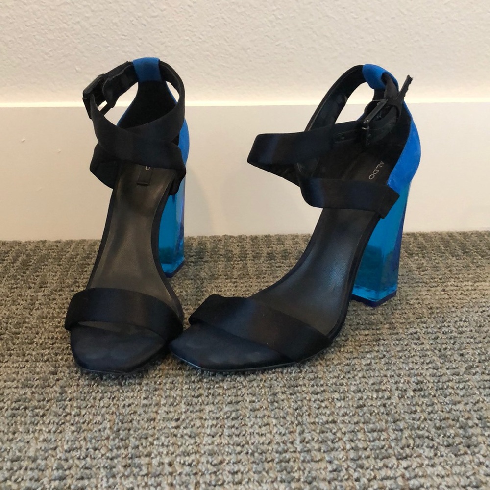 Black strappy heels with transparent blue heels